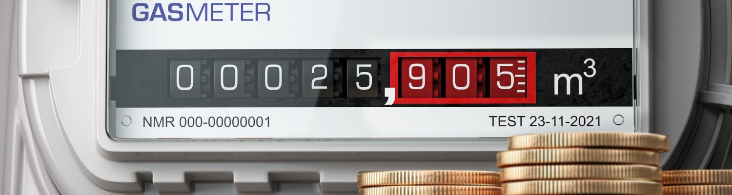 Growth of natural gas price. Gas meter with stacks of coins.